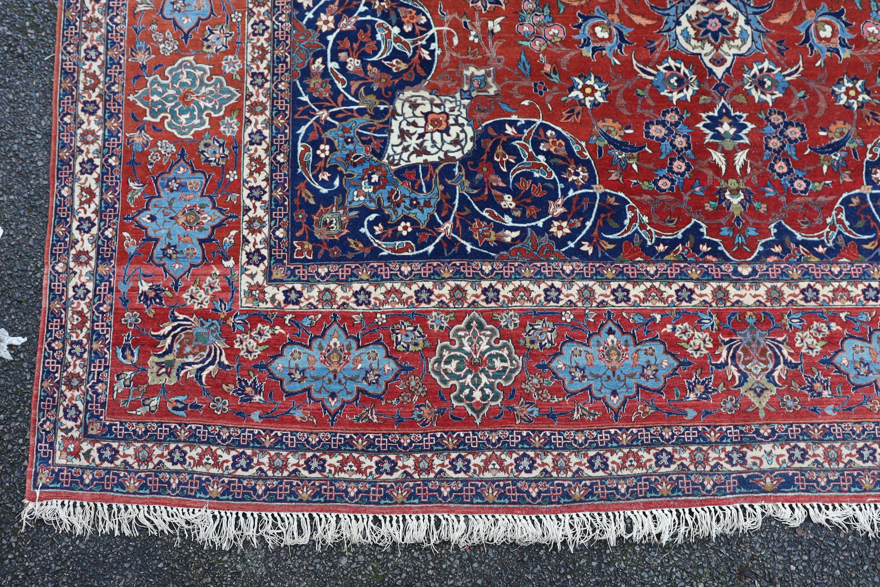 A Isfahan red ground carpet 350 x 260cm.